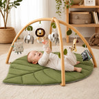 Alfombra de actividades para bebés con diseño de hoja acolchada y juguetes desmontables, ideal para estimulación sensorial y juego seguro. 0