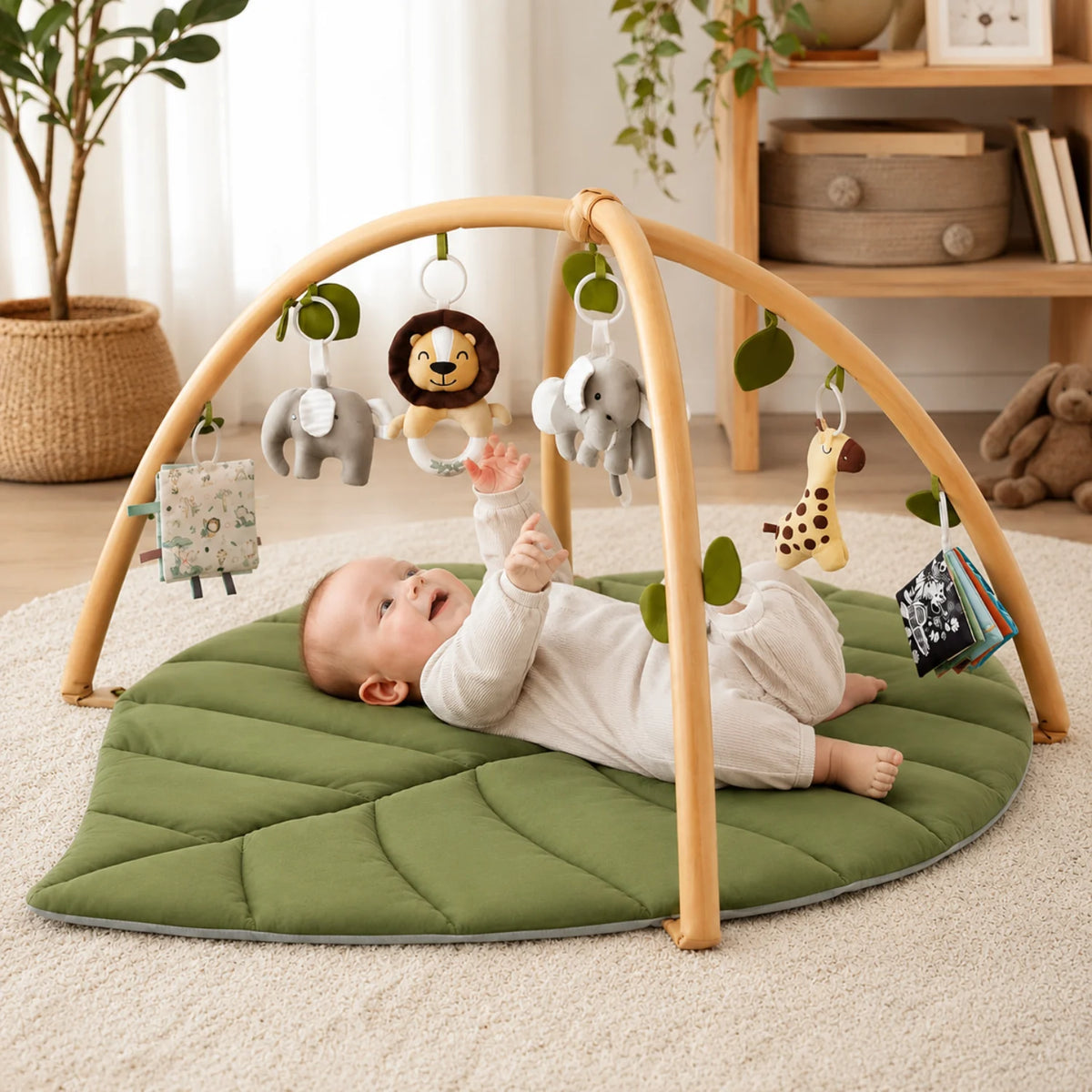 Alfombra de actividades para bebés con diseño de hoja acolchada y juguetes desmontables, ideal para estimulación sensorial y juego seguro. 0