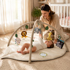 Alfombra de actividades para bebés con diseño de hoja acolchada y juguetes desmontables, ideal para estimulación sensorial y juego seguro. 1