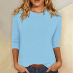 Blusa casual de manga 3/4 con cuello redondo, diseñada con una mezcla de telas para un estilo diario cómodo y moderno. 0