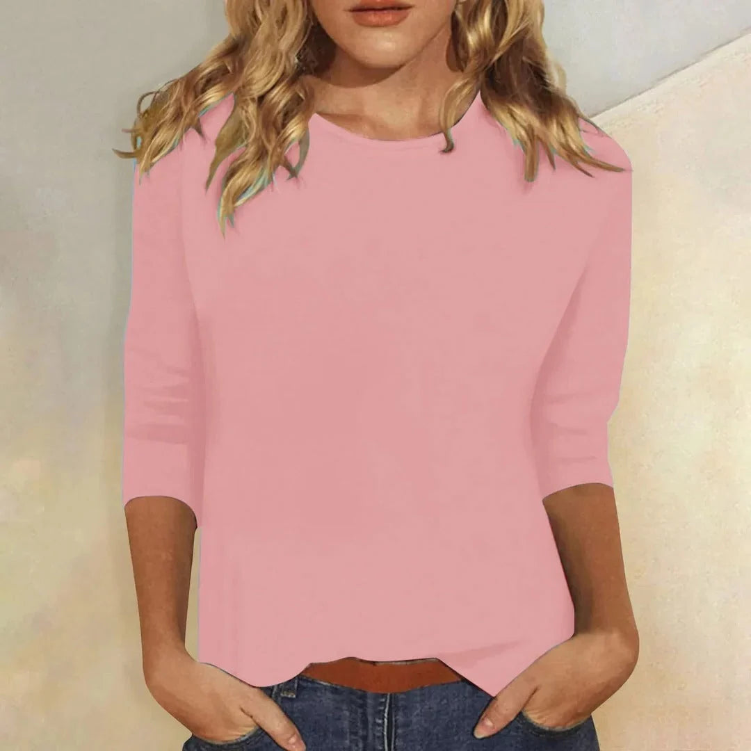 Blusa casual de manga 3/4 con cuello redondo, diseñada con una mezcla de telas para un estilo diario cómodo y moderno. 1