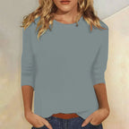 Blusa casual de manga 3/4 con cuello redondo, diseñada con una mezcla de telas para un estilo diario cómodo y moderno. 3