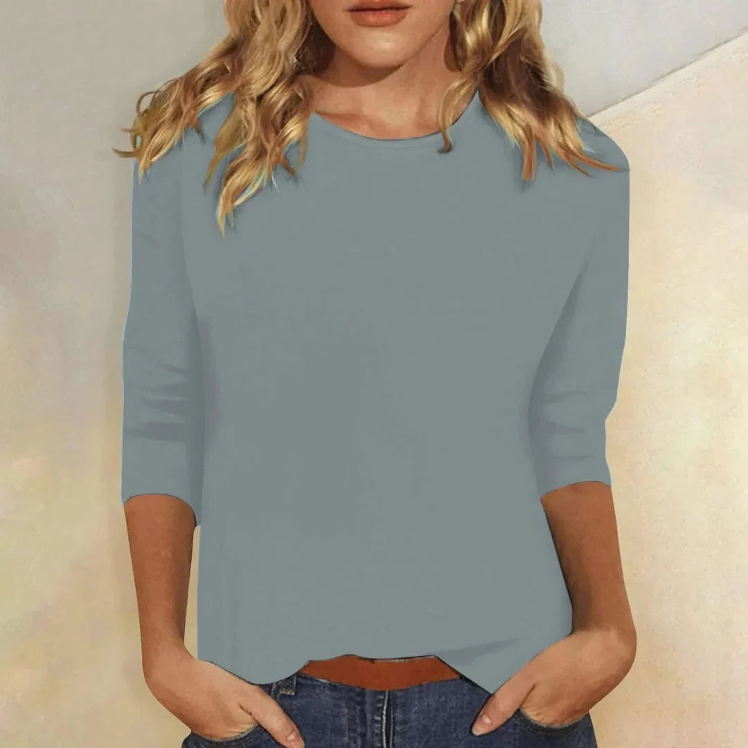 Blusa casual de manga 3/4 con cuello redondo, diseñada con una mezcla de telas para un estilo diario cómodo y moderno. 3