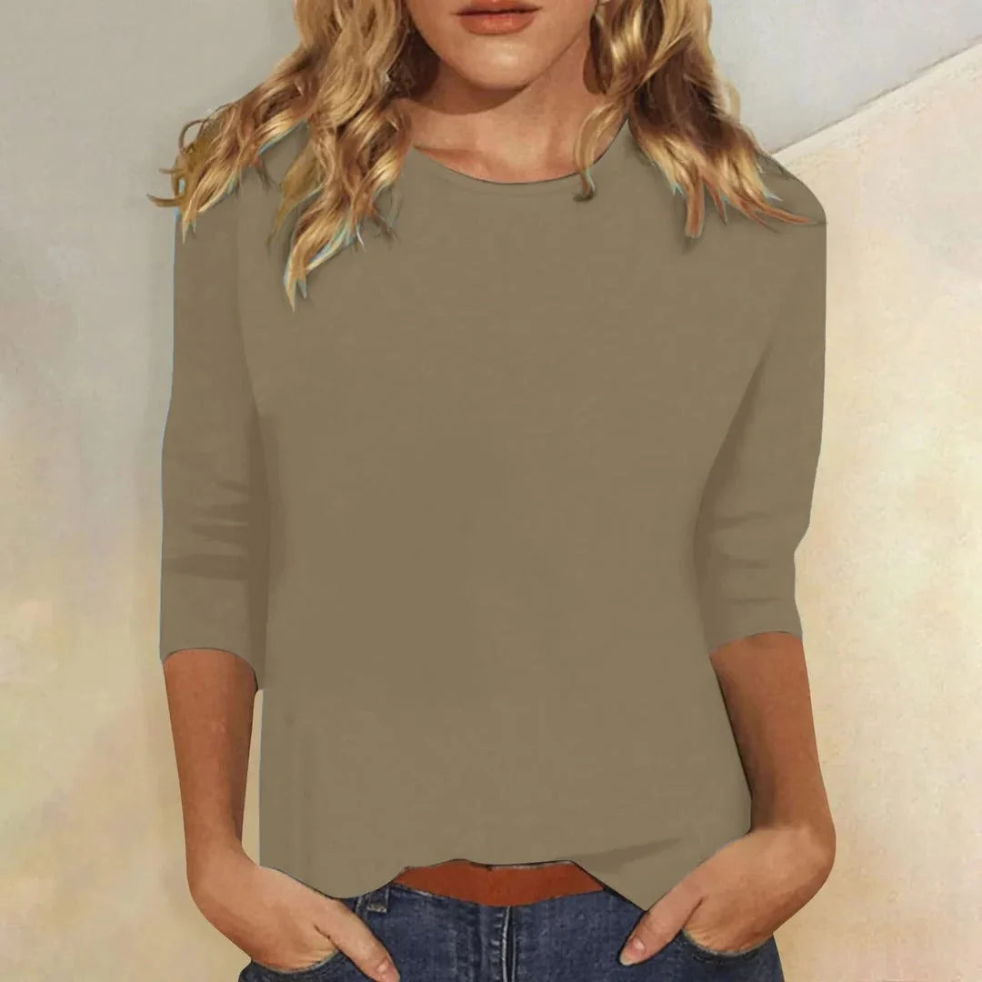 Blusa casual de manga 3/4 con cuello redondo, diseñada con una mezcla de telas para un estilo diario cómodo y moderno. 6