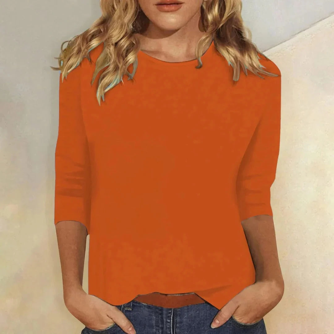Blusa casual de manga 3/4 con cuello redondo, diseñada con una mezcla de telas para un estilo diario cómodo y moderno. 7