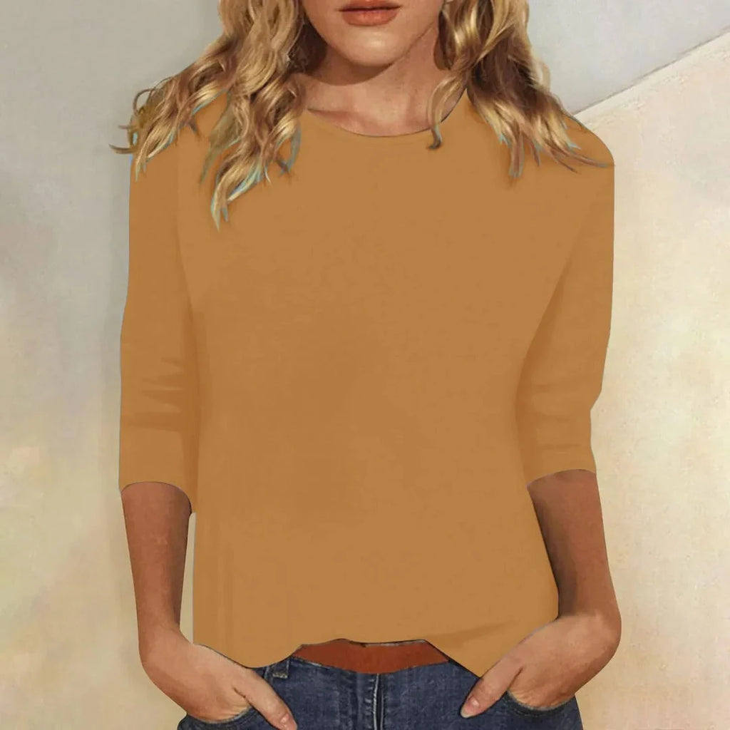 Blusa casual de manga 3/4 con cuello redondo, diseñada con una mezcla de telas para un estilo diario cómodo y moderno. 8