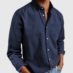 Camisa de hombre clásica de mangas largas con bolsillo, confeccionada en tejido suave y transpirable, perfecta para oficina y ocasiones casuales. 0