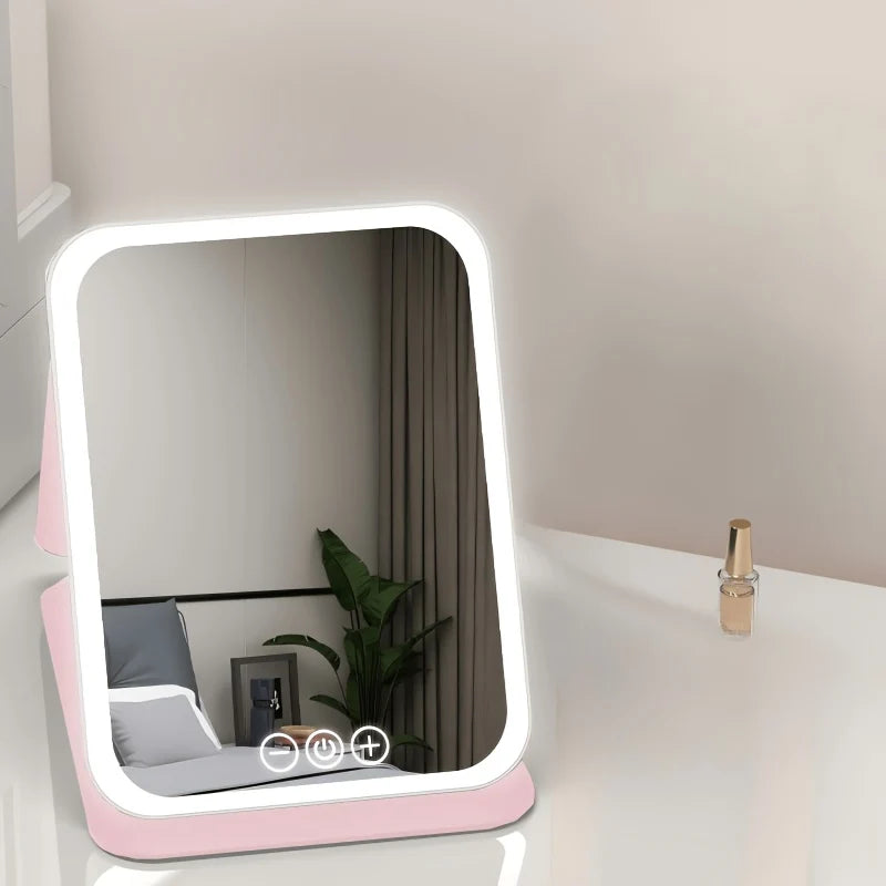 Espejo tocador con luz táctil, plegable y portátil, de diseño moderno en plástico rosa, ideal para maquillaje y cuidado personal. 1