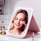 Espejo tocador con luz táctil, plegable y portátil, de diseño moderno en plástico rosa, ideal para maquillaje y cuidado personal. 4
