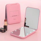 Espejo de Maquillaje Compacto con Luz LED y Aumento Doble – Diseño Plegable y Portátil en Rosa y Verde 0