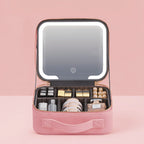Estuche de maquillaje rosa y negro con espejo LED ajustable y separadores personalizables, ideal para organizar cosméticos y accesorios de belleza. 0