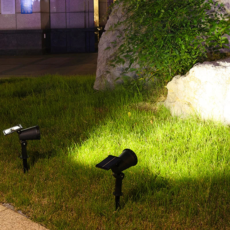 Foco solar exterior ajustable con luz natural cálida y multicolor, ideal para decoración de jardín y iluminación sostenible. 2