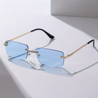 Gafas de sol sin montura con protección UV, marco metálico ligero y diseño moderno unisex, ideales para cualquier ocasión. 4
