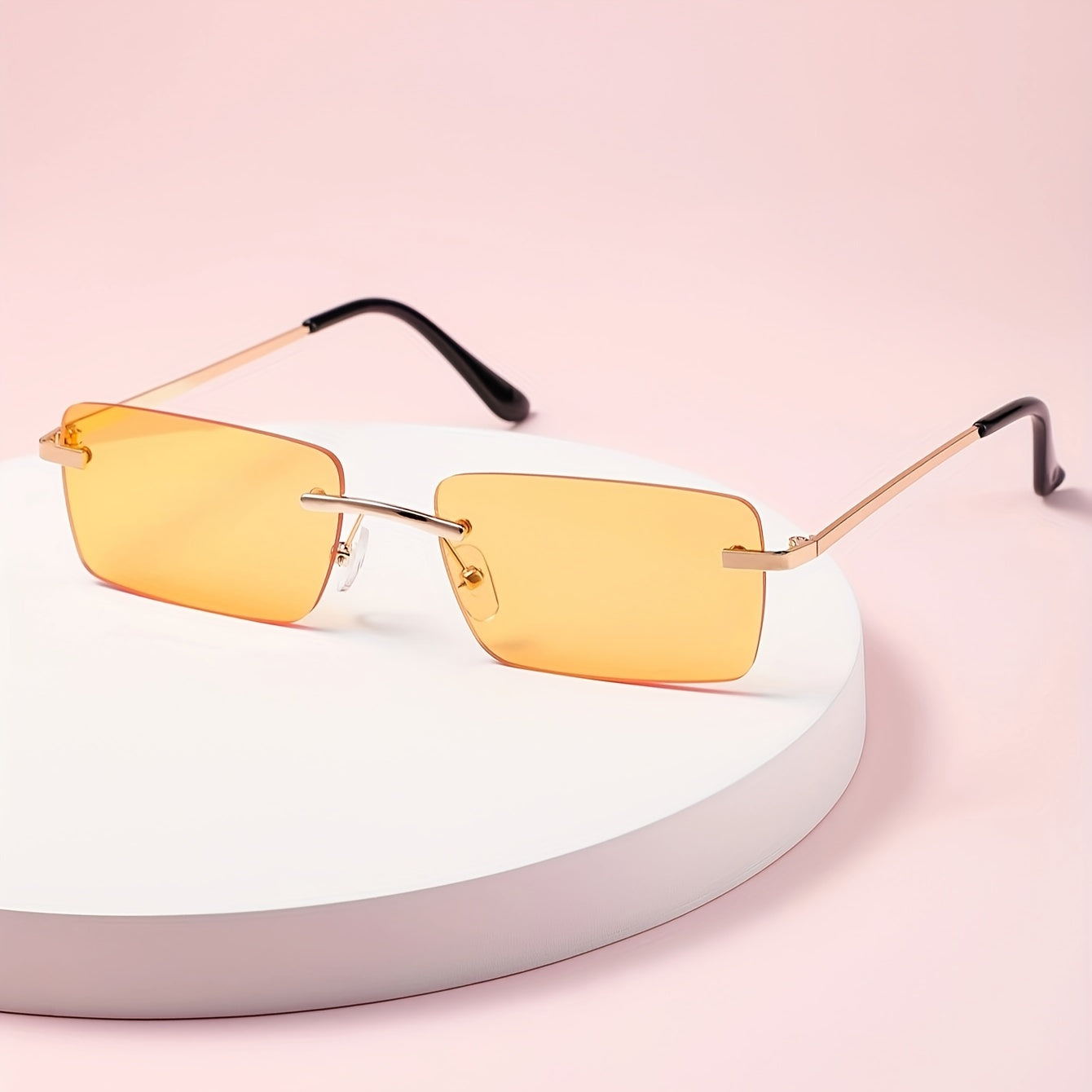 Gafas de sol sin montura con protección UV, marco metálico ligero y diseño moderno unisex, ideales para cualquier ocasión. 6