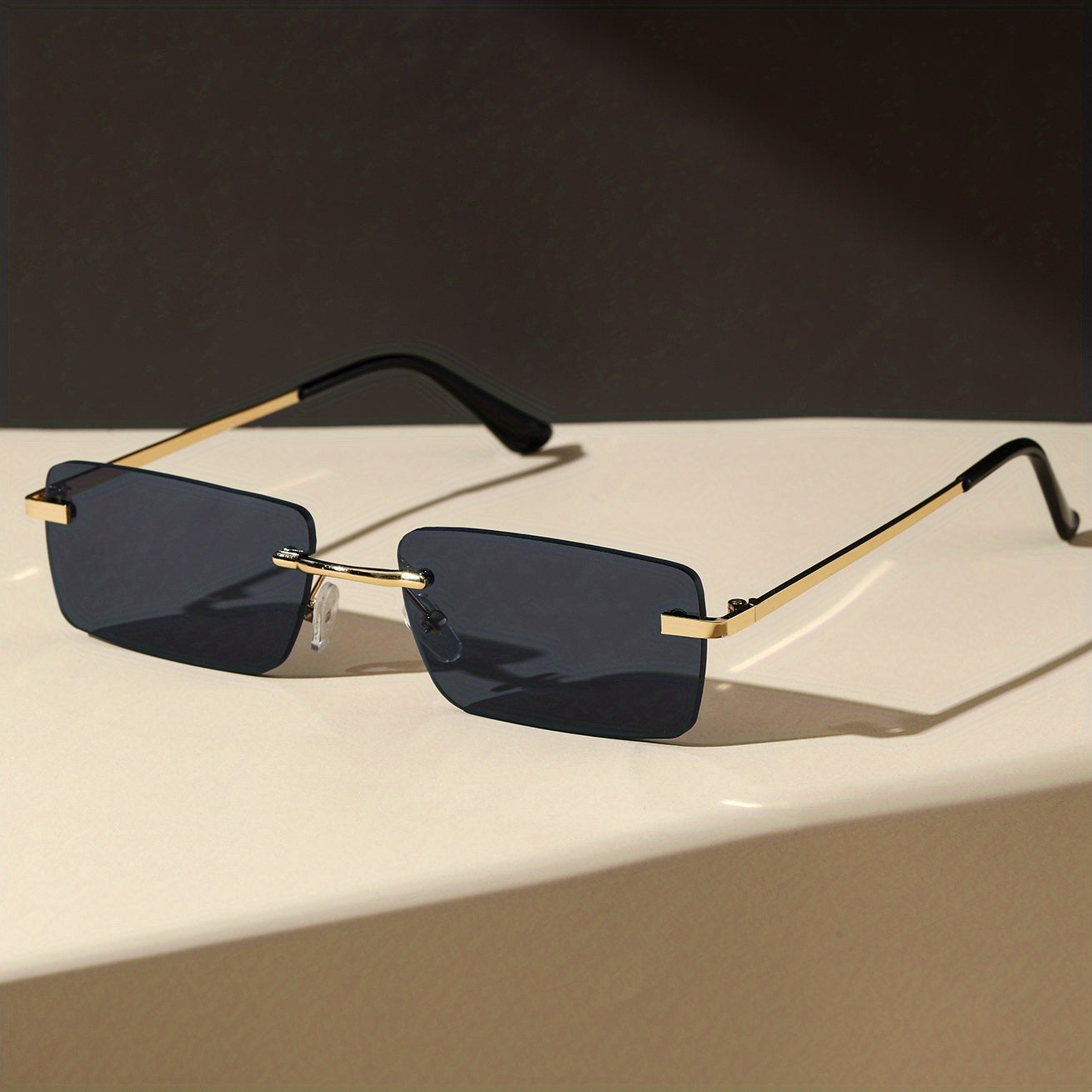 Gafas de sol sin montura con protección UV, marco metálico ligero y diseño moderno unisex, ideales para cualquier ocasión. 7