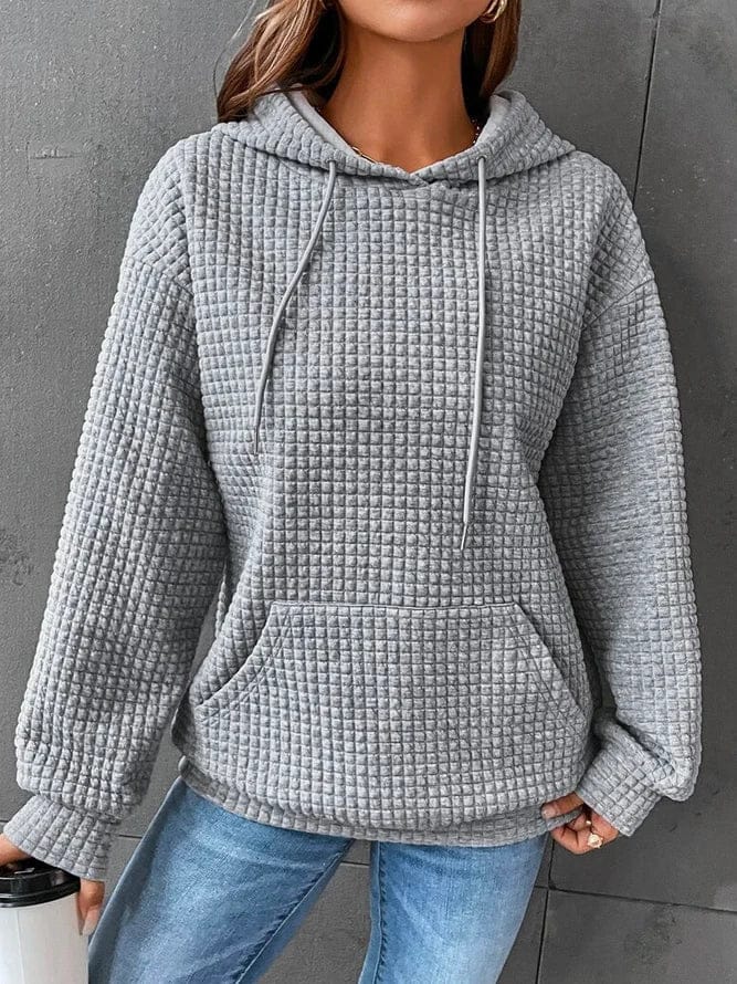 Sudadera mujer negra con capucha ajustable y bolsillo canguro, corte relajado en punto gofrado texturizado. 6