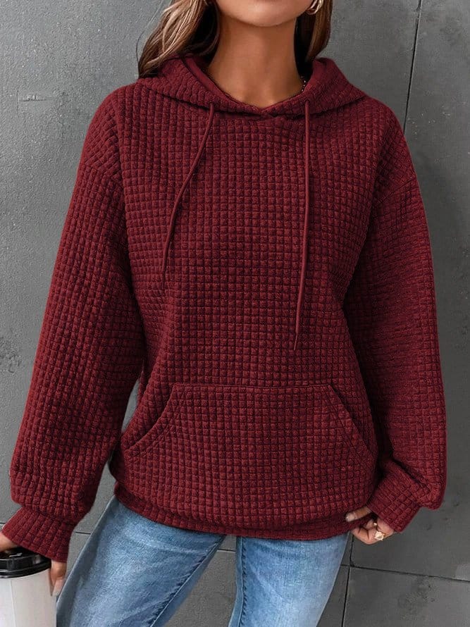 Sudadera mujer negra con capucha ajustable y bolsillo canguro, corte relajado en punto gofrado texturizado. 7