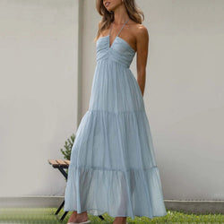 Vestido largo escalonado con escote halter ajustable, confeccionado en tejido ligero y transpirable, ideal para el verano. 0