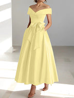 Vestido de madrina de boda en satén fucsia, largo al tobillo, con hombros descubiertos y prácticos bolsillos. 6